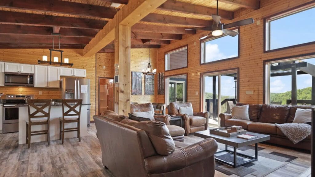 Livingroom Redpoint | Scenic Cabin Rentals Open-concept Living Room with Large Windows That Show the Expansive Red River Gorge.