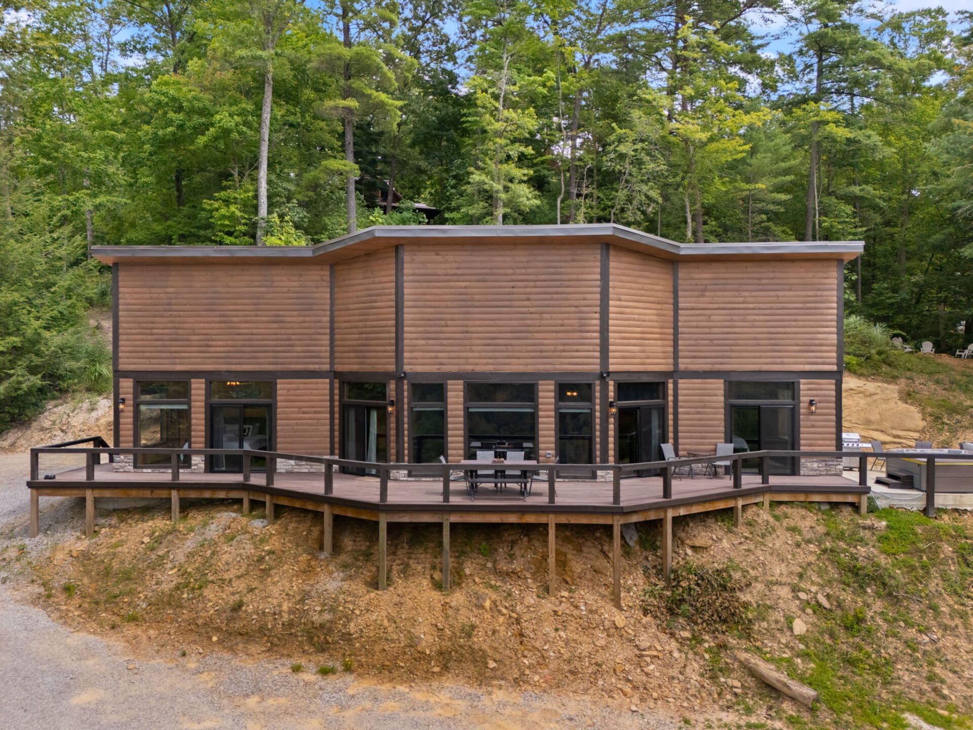 a Cabin Built into a Cliff, Featuring a Sandstone Wall Inside.